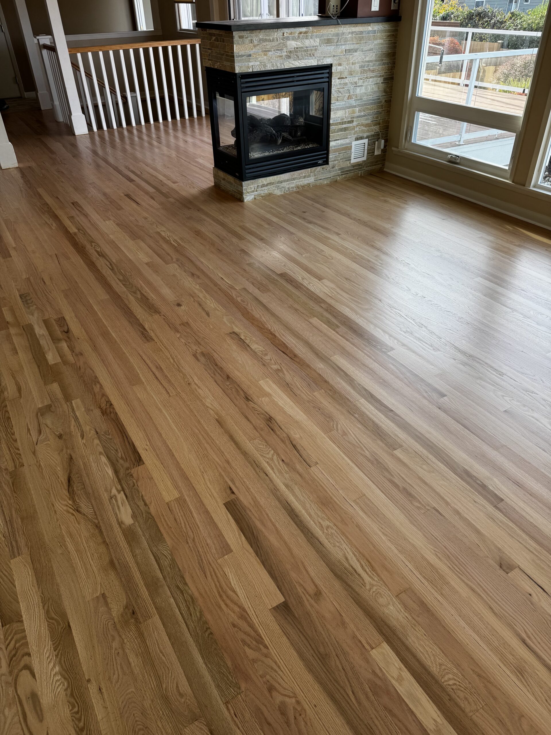 Red oak hardwood floor refinishing in Seattle WA with dustless sanding and water-based finish