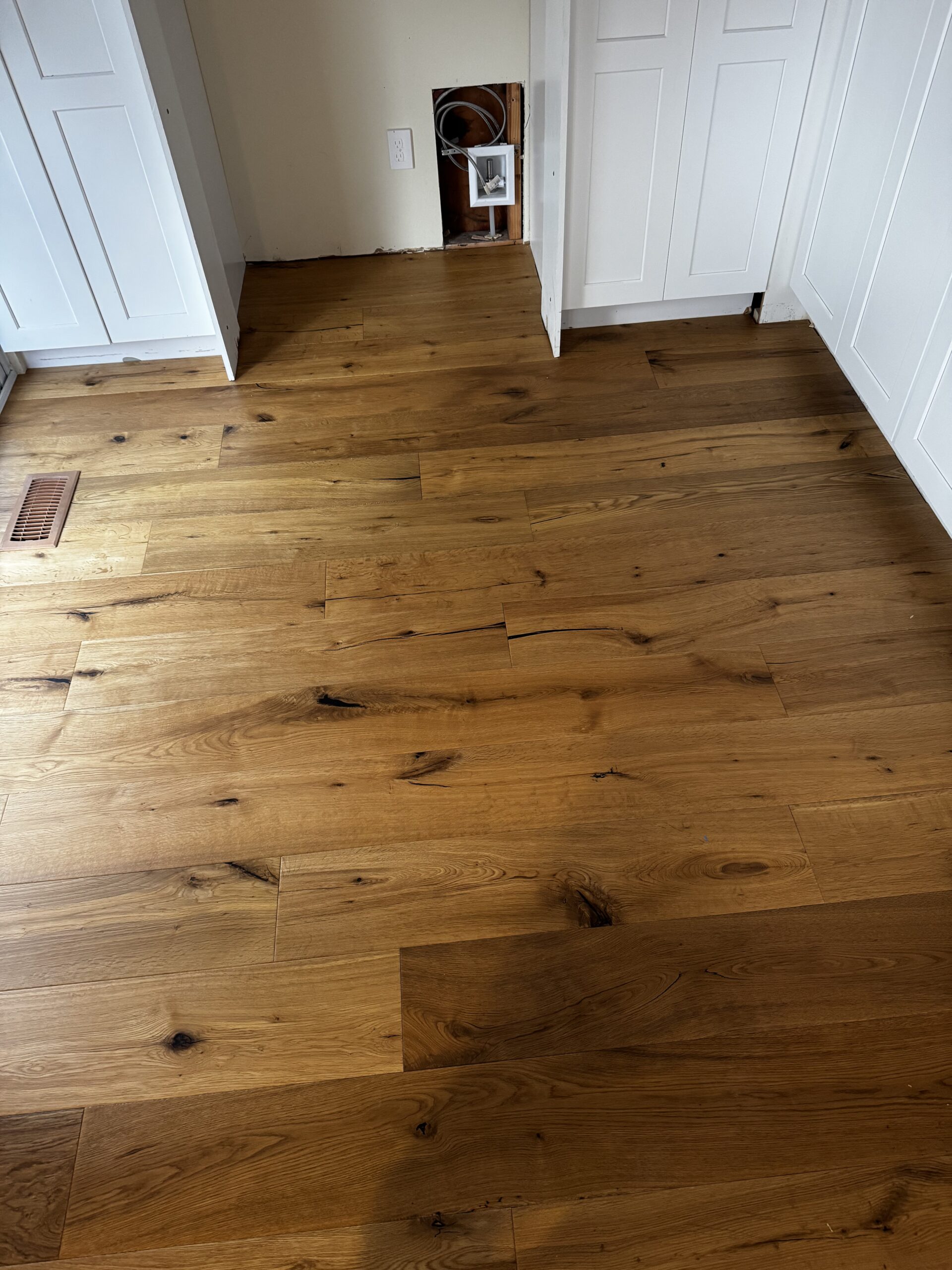 Engineered hardwood installation in Redmond WA with subfloor replacement and self-leveling compound