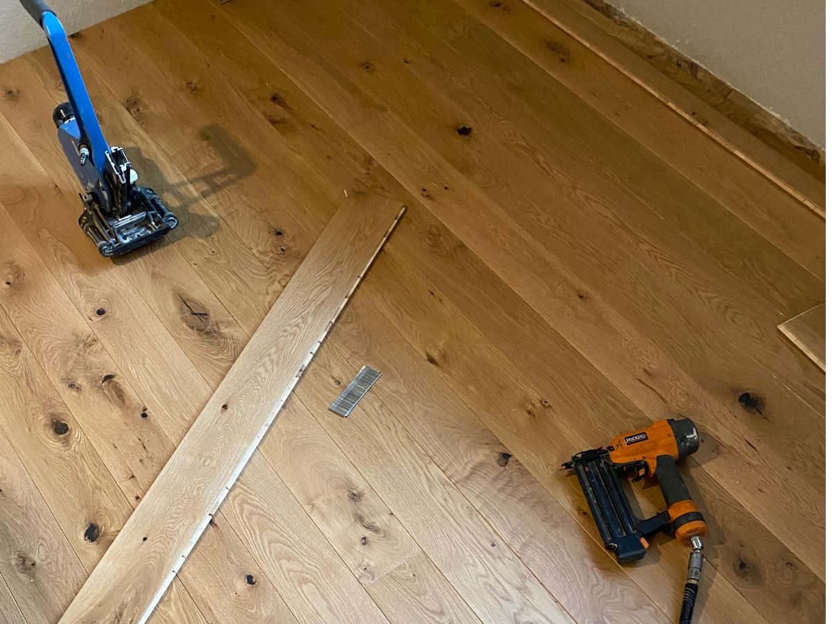 Nail-down engineered hardwood floor installation over plywood subfloor in Seattle WA