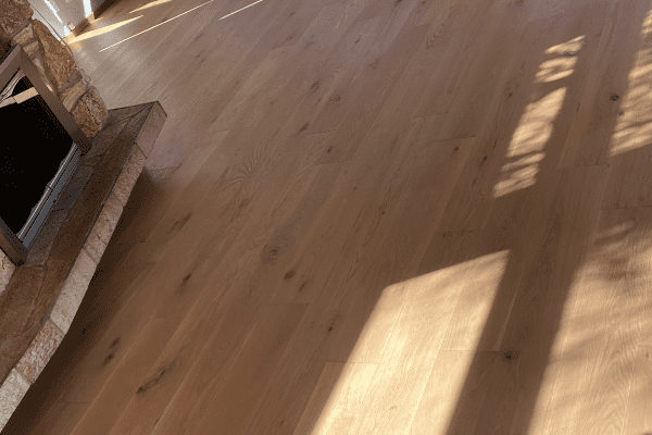 Wooden floor with stone fireplace, carpet replacement Redmond, Kirkland, Sammamish, Issaquah, Bellevue