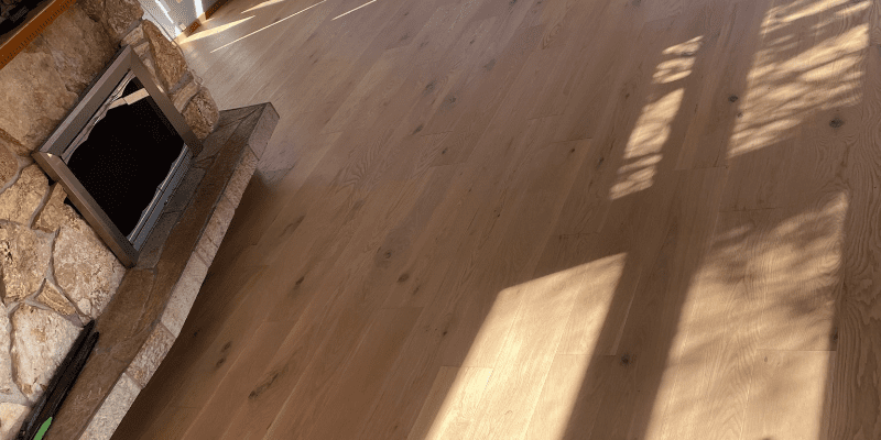 Wooden floor with stone fireplace, carpet replacement Redmond, Kirkland, Sammamish, Issaquah, Bellevue
