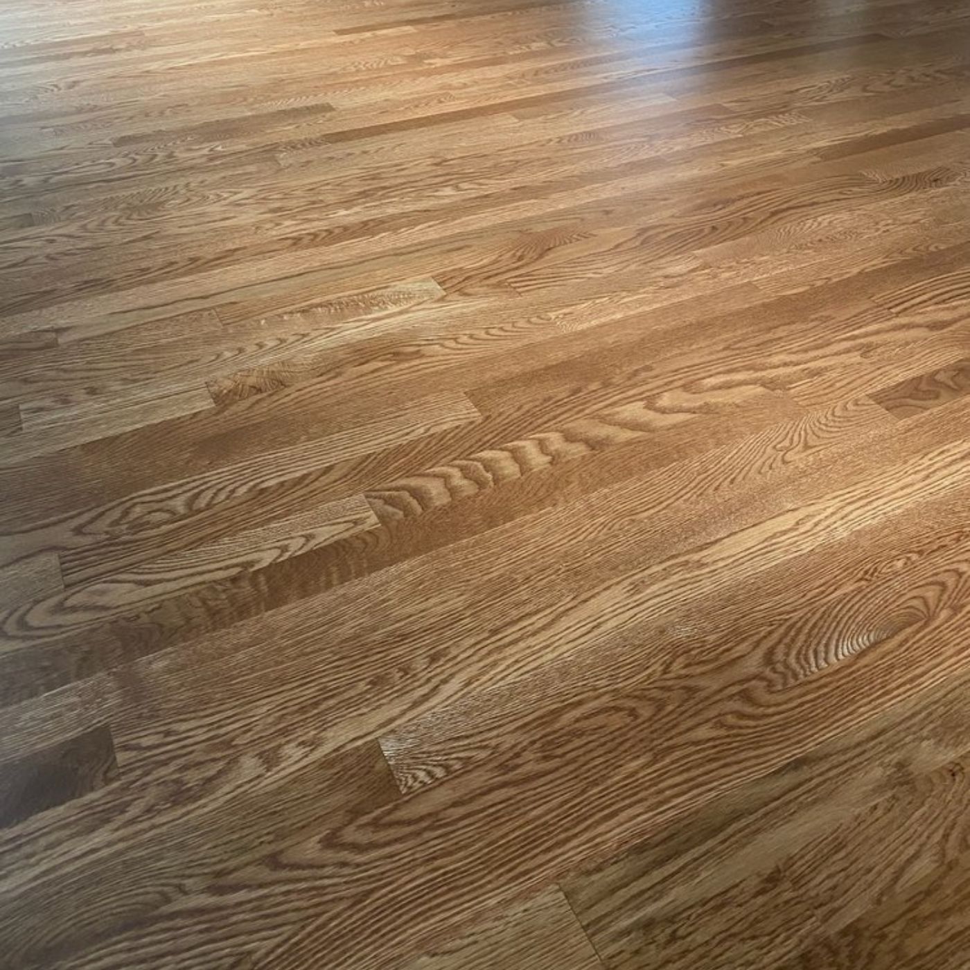 Premium hardwood floor refinishing project in Seattle WA by LUKS Construction