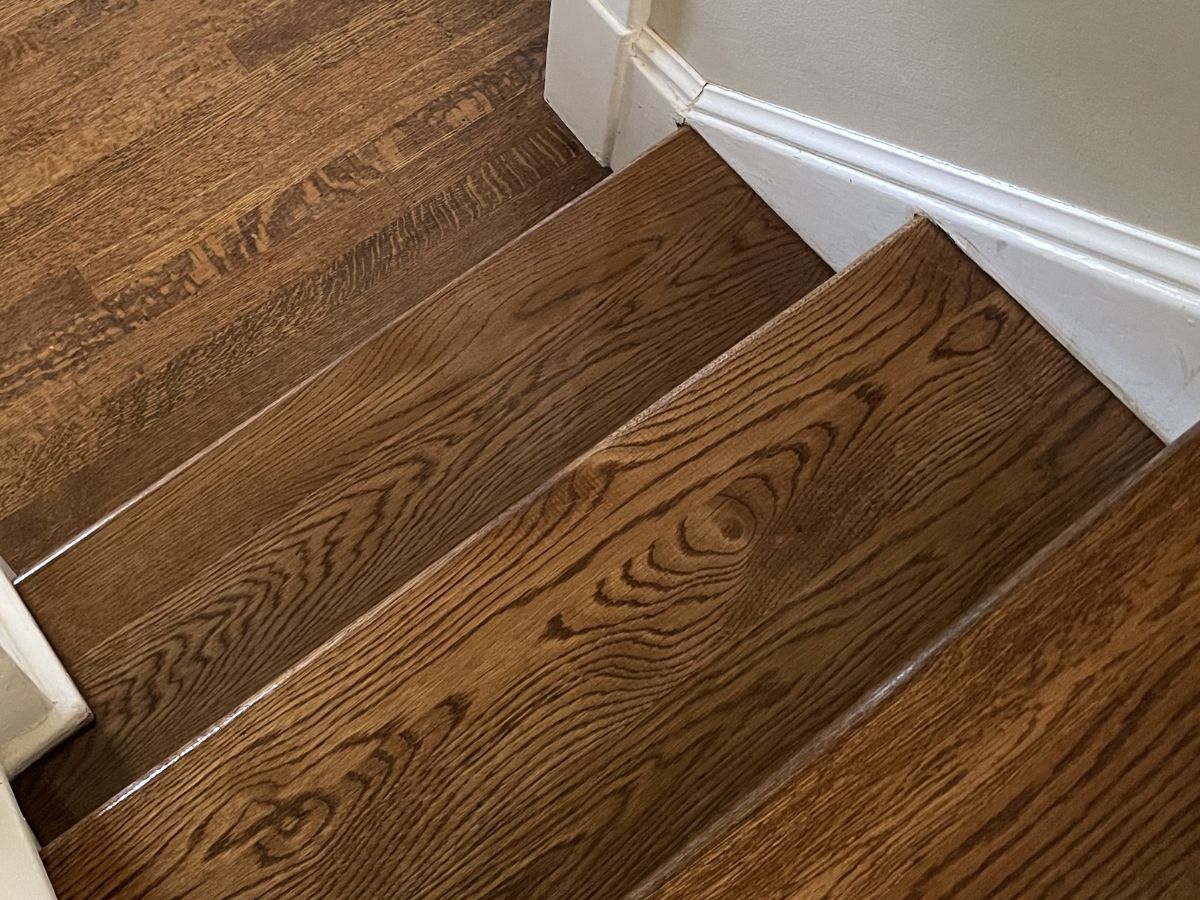 Hardwood stairs refinishing with sanding and water based finish in Kirkland WA